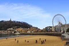 La Concha beach at San Sebastian, Spain. In the distance the old town royalty free stock photos La Concha beach at San Sebastian, Spain. In the distance the old town royalty free stock photos