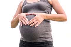 La femme asiatique enceinte a mis ses mains sur le ventre Images libres de droits La femme asiatique enceinte a mis ses mains sur le ventre Images libres de droits