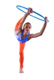 La fille folâtre adolescente fait des exercices avec le cercle t de danse polynésienne sur le fond gris Avoir l'amusement jouant images libres de droits La fille folâtre adolescente fait des exercices avec le cercle t de danse polynésienne sur le fond gris Avoir l'amusement jouant images libres de droits