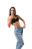 La fille mince dans le soutien-gorge noir et les jeans ont isolé le tir images libres de droits La fille mince dans le soutien-gorge noir et les jeans ont isolé le tir images libres de droits