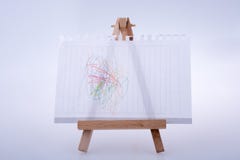 La hoja del Libro Blanco puso el trípode para pintar Fotos de archivo libres de regalías La hoja del Libro Blanco puso el trípode para pintar Fotos de archivo libres de regalías