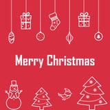 La inscripción de la Feliz Navidad en un fondo rojo con deco Foto de archivo La inscripción de la Feliz Navidad en un fondo rojo con deco Foto de archivo