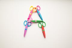 La lettera A ha fatto dalle forbici di colore immagini stock libere da diritti La lettera A ha fatto dalle forbici di colore immagini stock libere da diritti