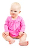 La niña sonriente hermosa en vestido se sienta foto de archivo La niña sonriente hermosa en vestido se sienta foto de archivo