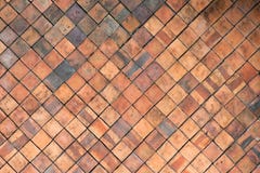 La terracotta piastrella la parete per il fondo astratto di struttura Fotografie Stock La terracotta piastrella la parete per il fondo astratto di struttura Fotografie Stock
