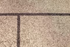 La textura del beige lanoso suave de la alfombra, el concepto de comodidad fotos de archivo La textura del beige lanoso suave de la alfombra, el concepto de comodidad fotos de archivo