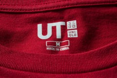 Label tag on Uniqlo shirt editorial photography. Image of center - 90170262