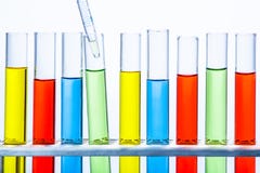 Laboratory pipette with drop of liquid over set of test lab tube royalty free stock photo Laboratory pipette with drop of liquid over set of test lab tube royalty free stock photo