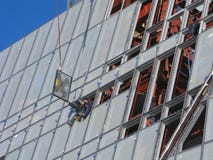 Laborers in window frame stock image Laborers in window frame stock image