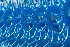 Laconic photo of blue sharp cultivator in the field royalty free stock photo Laconic photo of blue sharp cultivator in the field royalty free stock photo