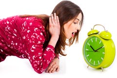 Lady Looking At Alarm Clock Stock Photography