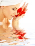 Lady with red petals in water