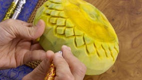 Lady`s hand crafting pumpkin in a floral pattern. Thai style royalty free stock images Lady`s hand crafting pumpkin in a floral pattern. Thai style royalty free stock images