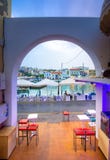 The lake Voulismeni in Agios Nikolaos, a picturesque coastal town with colorful buildings around the port. stock photo The lake Voulismeni in Agios Nikolaos, a picturesque coastal town with colorful buildings around the port. stock photo