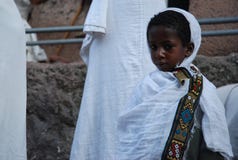 Lalibela, Wollo, Ethiopia, circa February 2007: Boy attending religious service royalty free stock photos Lalibela, Wollo, Ethiopia, circa February 2007: Boy attending religious service royalty free stock photos
