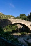 Landscape of an ancient stone bridge over a dry river