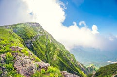 Landscape breathtaking view of a valley from a high mountain at cloud level on a sunny day stock images Landscape breathtaking view of a valley from a high mountain at cloud level on a sunny day stock images