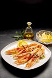 Langoustine Shellfish Served with Lemon and Oil Stock Images Langoustine Shellfish Served with Lemon and Oil Stock Images