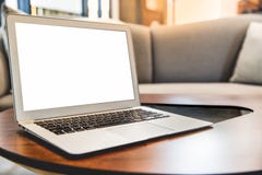Laptop with blank screen on table in living room. royalty free stock images Laptop with blank screen on table in living room. royalty free stock images