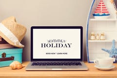 Laptop computer mock up template with beach items and home decor objects. Planning summer holiday vacation royalty free stock photo Laptop computer mock up template with beach items and home decor objects. Planning summer holiday vacation royalty free stock photo