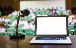 Laptop and microphone on the rostrum Stock Image Laptop and microphone on the rostrum Stock Image