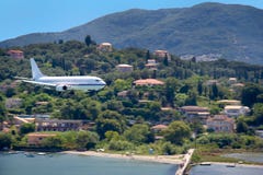 Large aircraft landing on Corfu island, Greece Stock Image Large aircraft landing on Corfu island, Greece Stock Image