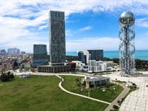 A beautiful metal tower alphabet and glass booms, buildings, skyscrapers on the coast. Batumi, Georgia, April 17, 2019 stock photo A beautiful metal tower alphabet and glass booms, buildings, skyscrapers on the coast. Batumi, Georgia, April 17, 2019 stock photo