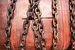 Large, brown, wooden casket, a piggy bank, a chest bound, closed with iron strong chains. royalty free stock photography Large, brown, wooden casket, a piggy bank, a chest bound, closed with iron strong chains. royalty free stock photography