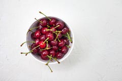 Large cherries on a white textured background royalty free stock image Large cherries on a white textured background royalty free stock image