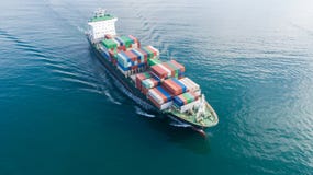 Large container ship at sea. Aerial top view of cargo container ship vessel import export container sailing