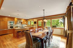 Large kitchen room with elegant dining table set stock image Large kitchen room with elegant dining table set stock image