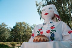 Large traditional doll greets guests with a loaf, stock images Large traditional doll greets guests with a loaf, stock images
