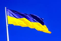 The largest yellow - blue state flag of Ukraine on the flagpole 30 meters in the Ukrainian Dnepr city stock photos The largest yellow - blue state flag of Ukraine on the flagpole 30 meters in the Ukrainian Dnepr city stock photos