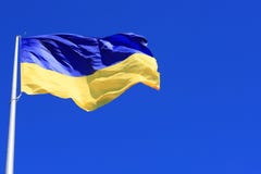 The largest yellow and blue state flag of Ukraine on the flagpole in the Ukrainian Dnepr city, Dnipropetrovsk, stock image The largest yellow and blue state flag of Ukraine on the flagpole in the Ukrainian Dnepr city, Dnipropetrovsk, stock image