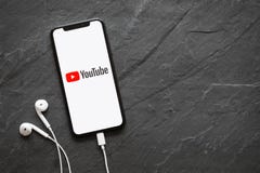 Riga, Latvia - March 25, 2018: Latest generation iPhone X with YouTube logo on the screen.