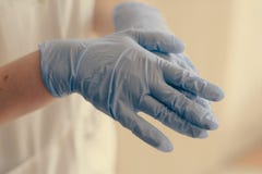 Latexläkarundersökninghandskar arkivbilder Latexläkarundersökninghandskar arkivbilder