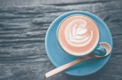 Latte Art, Blue Coffee Cup On Wooden Background Royalty Free Stock Photo