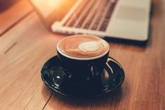 Latte coffee while working with laptop computer royalty free stock image Latte coffee while working with laptop computer royalty free stock image