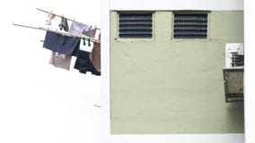 Laundry clothes hanging drying on window building Stock Images Laundry clothes hanging drying on window building Stock Images