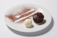 Lava cake with ice cream on a white plate. stock image Lava cake with ice cream on a white plate. stock image