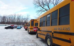 Laval, Quebec, CANADA – February 14, 2019: Laval School Bus`s parked up during the snow in the school or kinder garden parking. royalty free stock photo Laval, Quebec, CANADA – February 14, 2019: Laval School Bus`s parked up during the snow in the school or kinder garden parking. royalty free stock photo