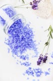Lavender sea salt in glass with fresh flowers on light background stock photos Lavender sea salt in glass with fresh flowers on light background stock photos