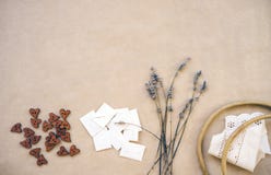 Lavender, wooden buttons, home-made envelopes, old wooden hoop and ribbons with hem on craft paper stock photos Lavender, wooden buttons, home-made envelopes, old wooden hoop and ribbons with hem on craft paper stock photos