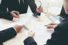 Lawyer and attorney having team meeting at law firm. stock photo Lawyer and attorney having team meeting at law firm. stock photo
