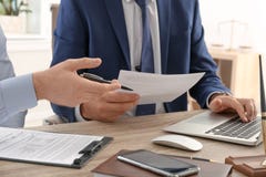 Lawyer working with client at table in office royalty free stock photo Lawyer working with client at table in office royalty free stock photo