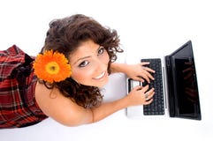 Laying woman with laptop stock photos Laying woman with laptop stock photos