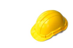 Le casque jaune d'ingénieur de sécurité sur un blanc a isolé le fond images libres de droits Le casque jaune d'ingénieur de sécurité sur un blanc a isolé le fond images libres de droits