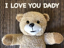 Le message ce JE T'AIME DADY par l'ours de nounours mignon photographie stock Le message ce JE T'AIME DADY par l'ours de nounours mignon photographie stock