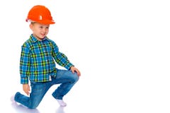 Le petit garçon dans le casque du constructeur photo libre de droits Le petit garçon dans le casque du constructeur photo libre de droits