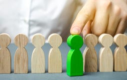The leader chooses the person in the the team. Talented worker. Hiring staff. Employee search. Promote. Human Resource Management royalty free stock images The leader chooses the person in the the team. Talented worker. Hiring staff. Employee search. Promote. Human Resource Management royalty free stock images
